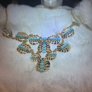 Gold plated palm tree leaves with fluorescent beads